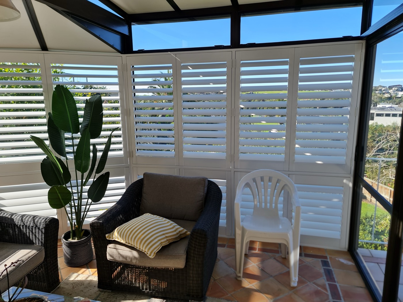 White shutters in a bedroom