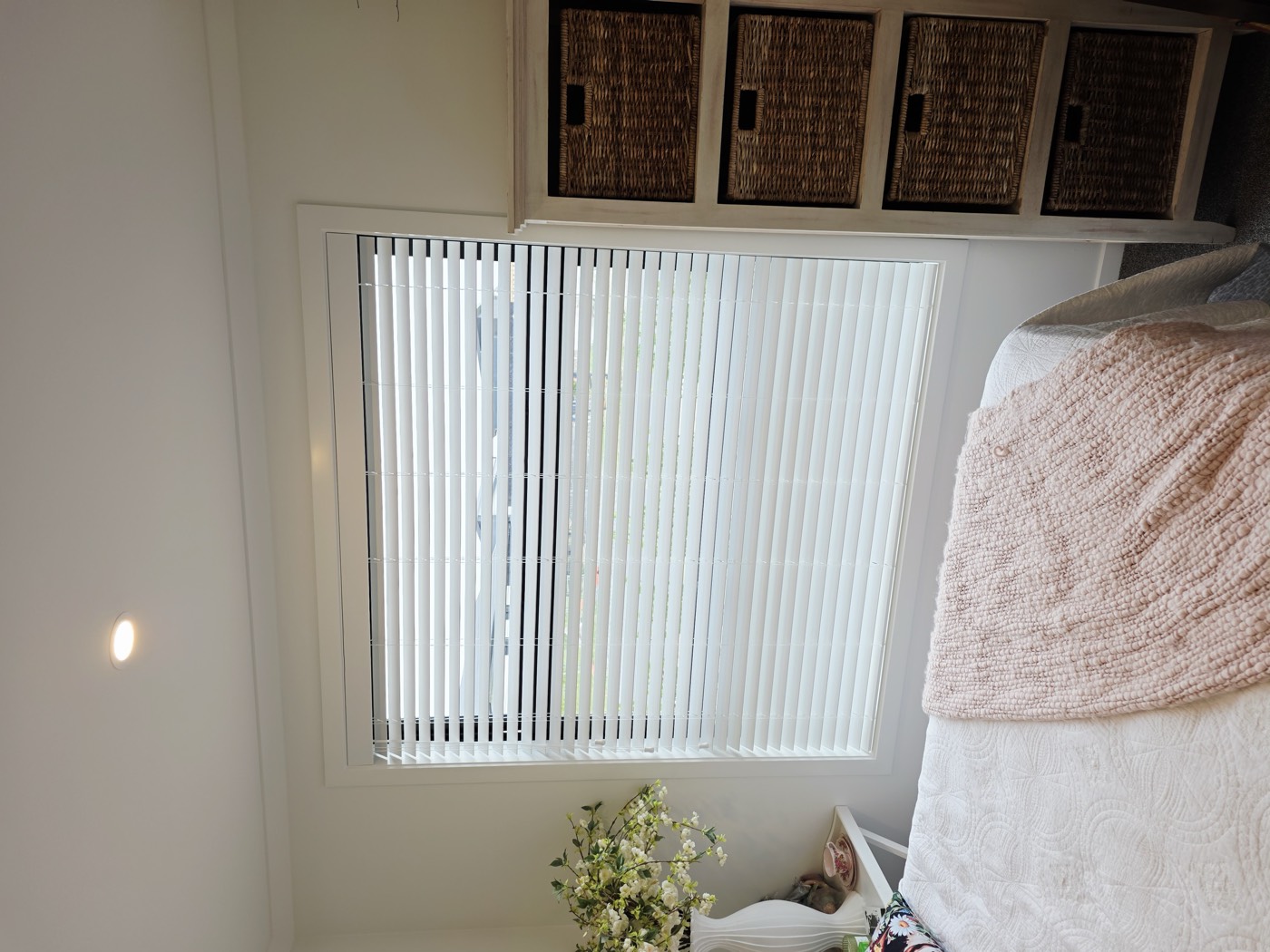 Venetian blinds in a styled bedroom