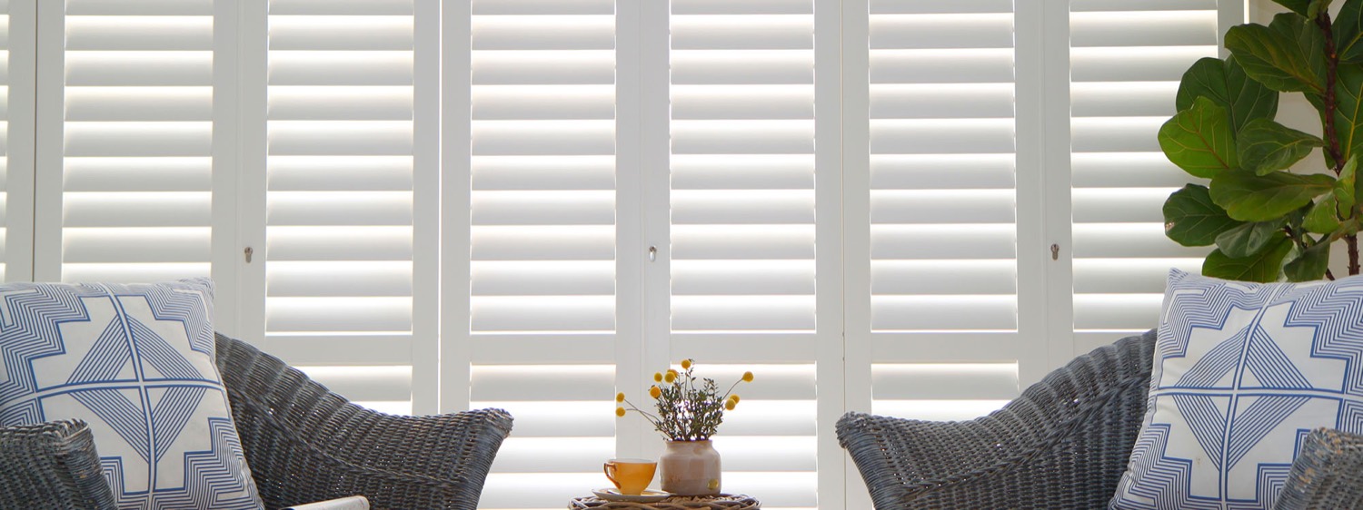 Bright living room with white plantation shutters