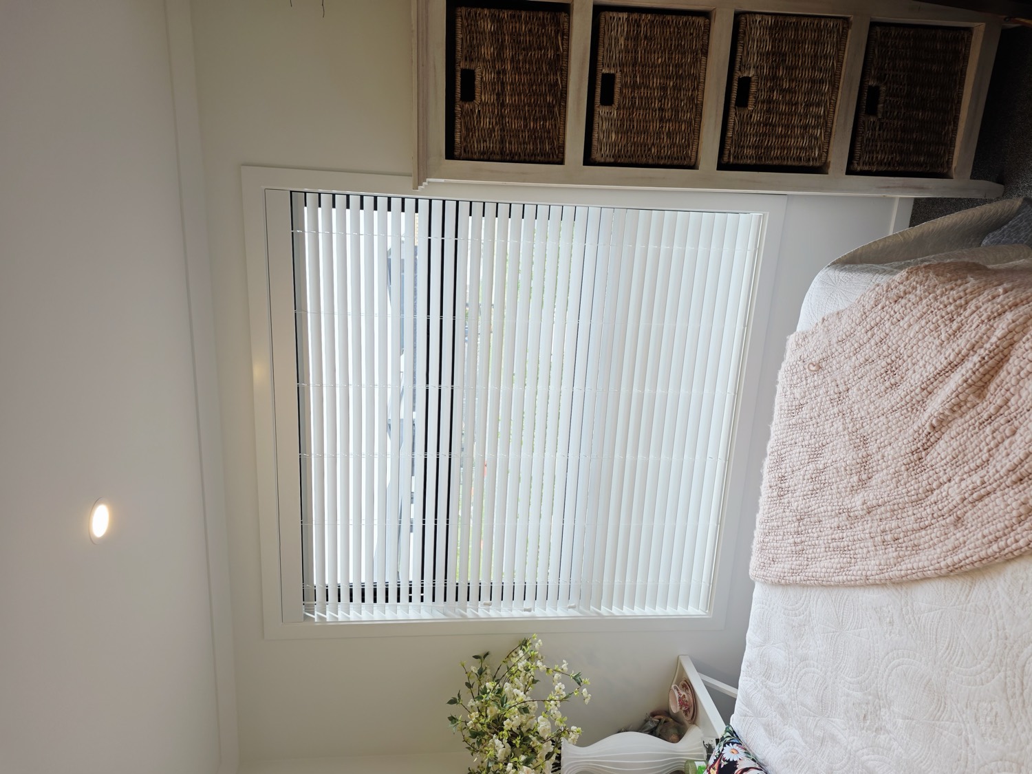 Bedroom with white venetian blinds
