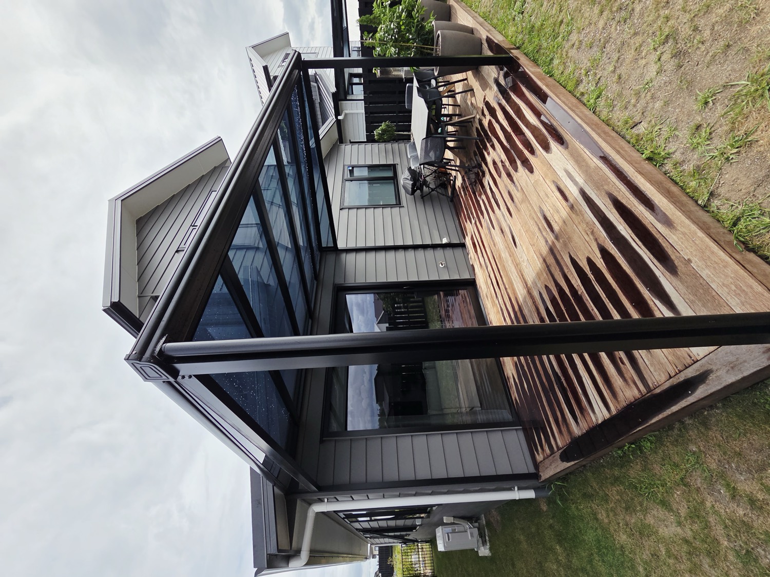 Outdoor shade canopy over a timber deck
